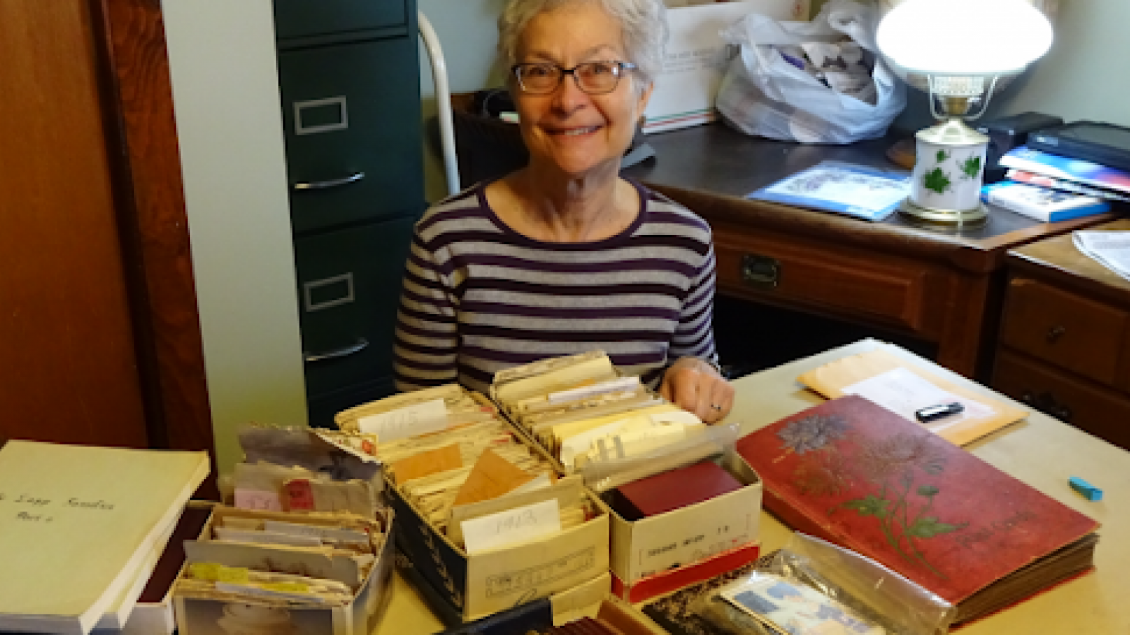 Barb Bradbury displays her family history archives at her home near Otway, Ohio