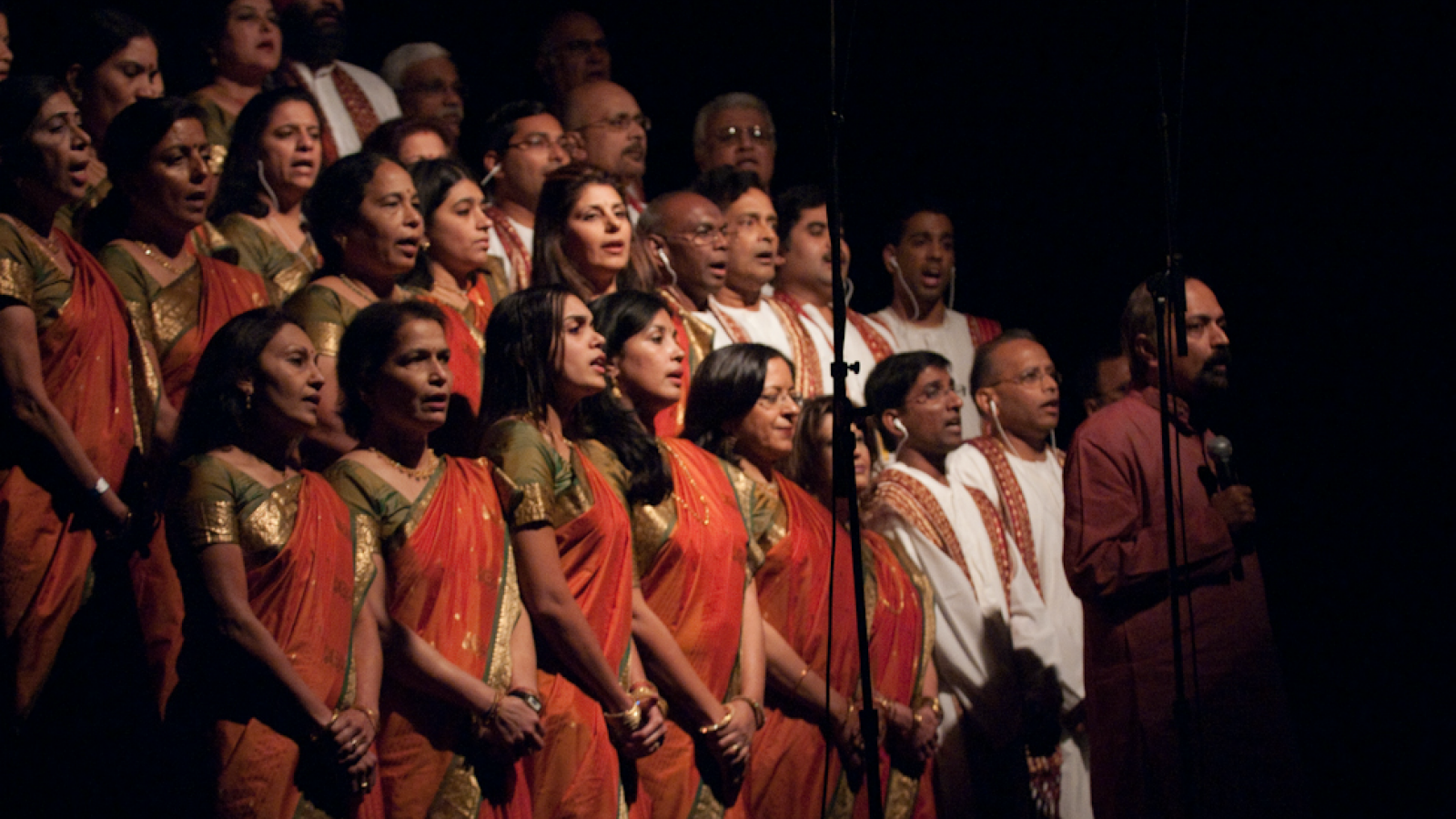 Kanniks standing in front of choir singers