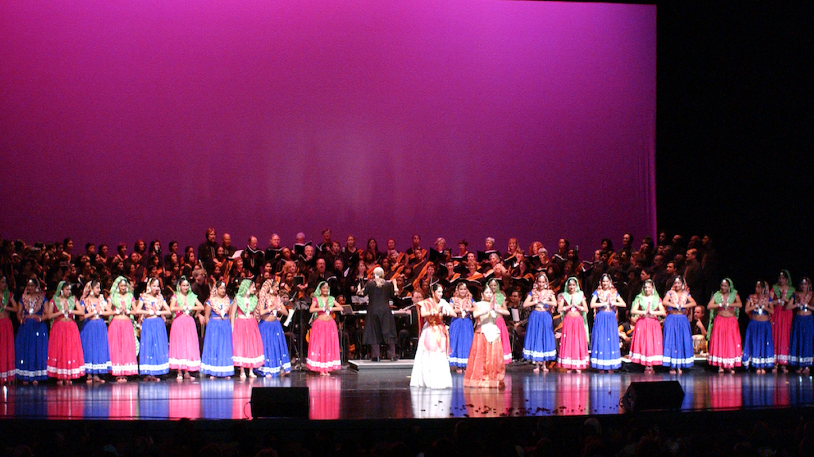 Choral singers and dancers onstage
