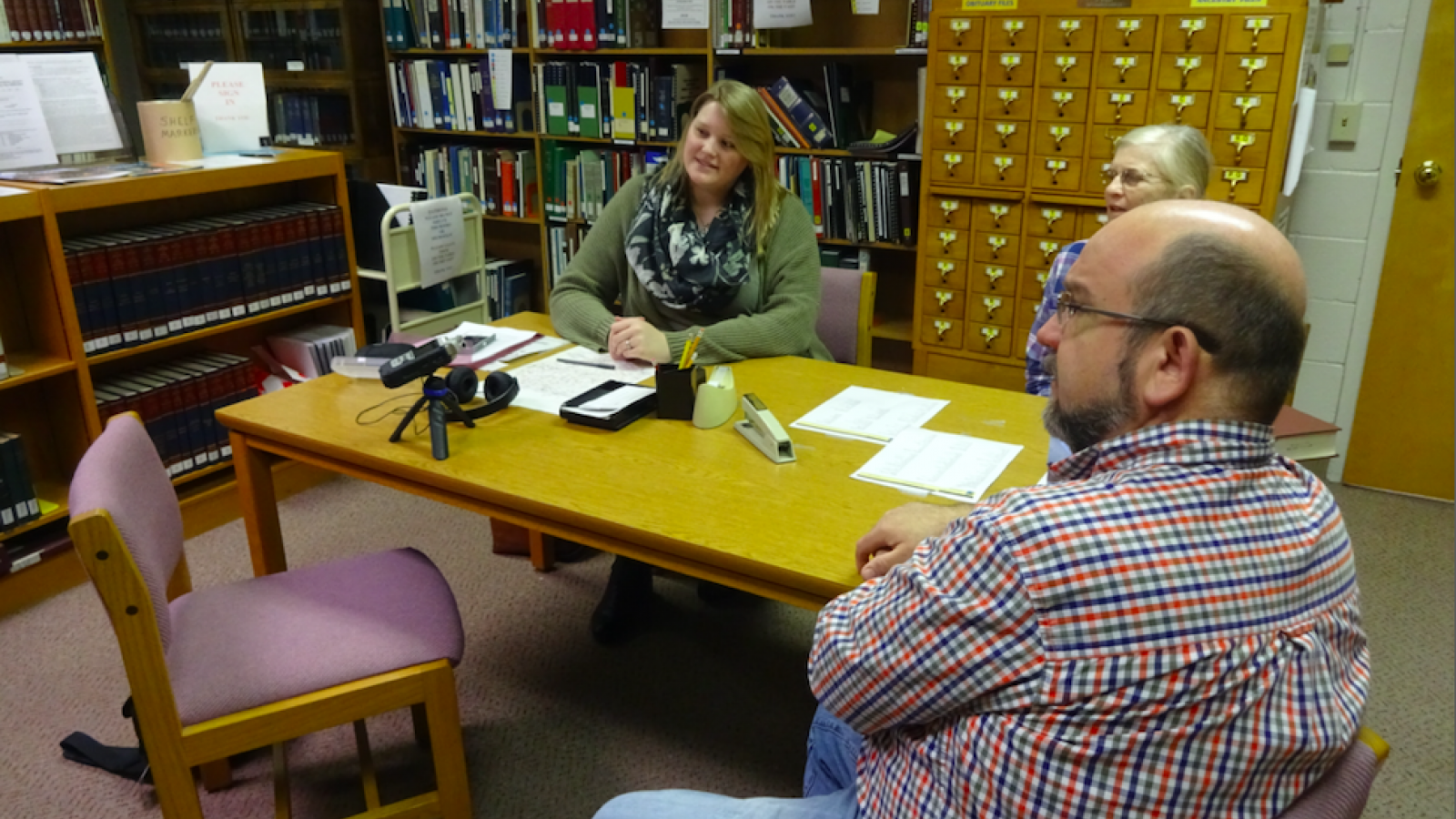 Fieldworker Sarah Hinkelman interviewing Pike county librarian Tom Adkins.