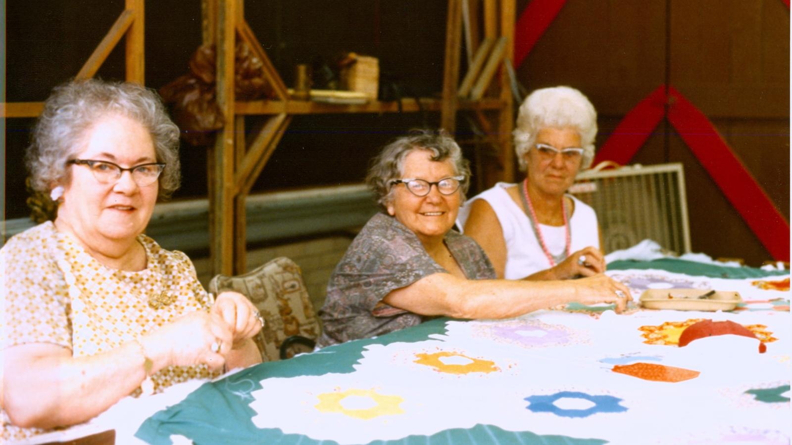 Thora Blackwood (center) and friends, quilting a quilt that she pieced. Pomeroy, Ohio, 1977.