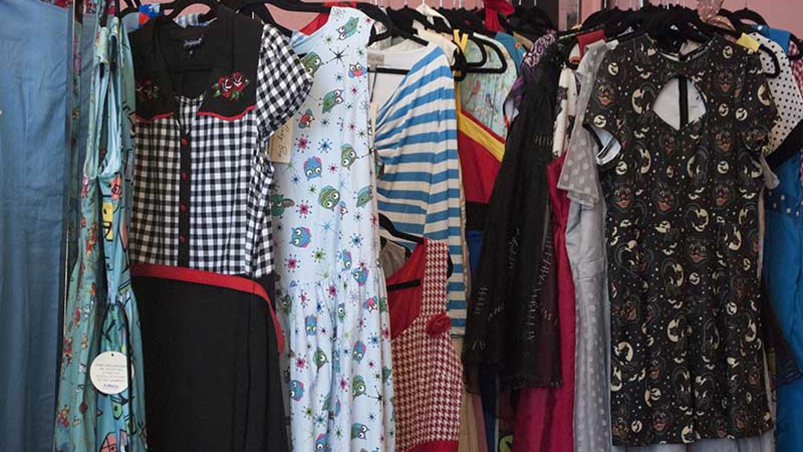 row of dresses on hangers