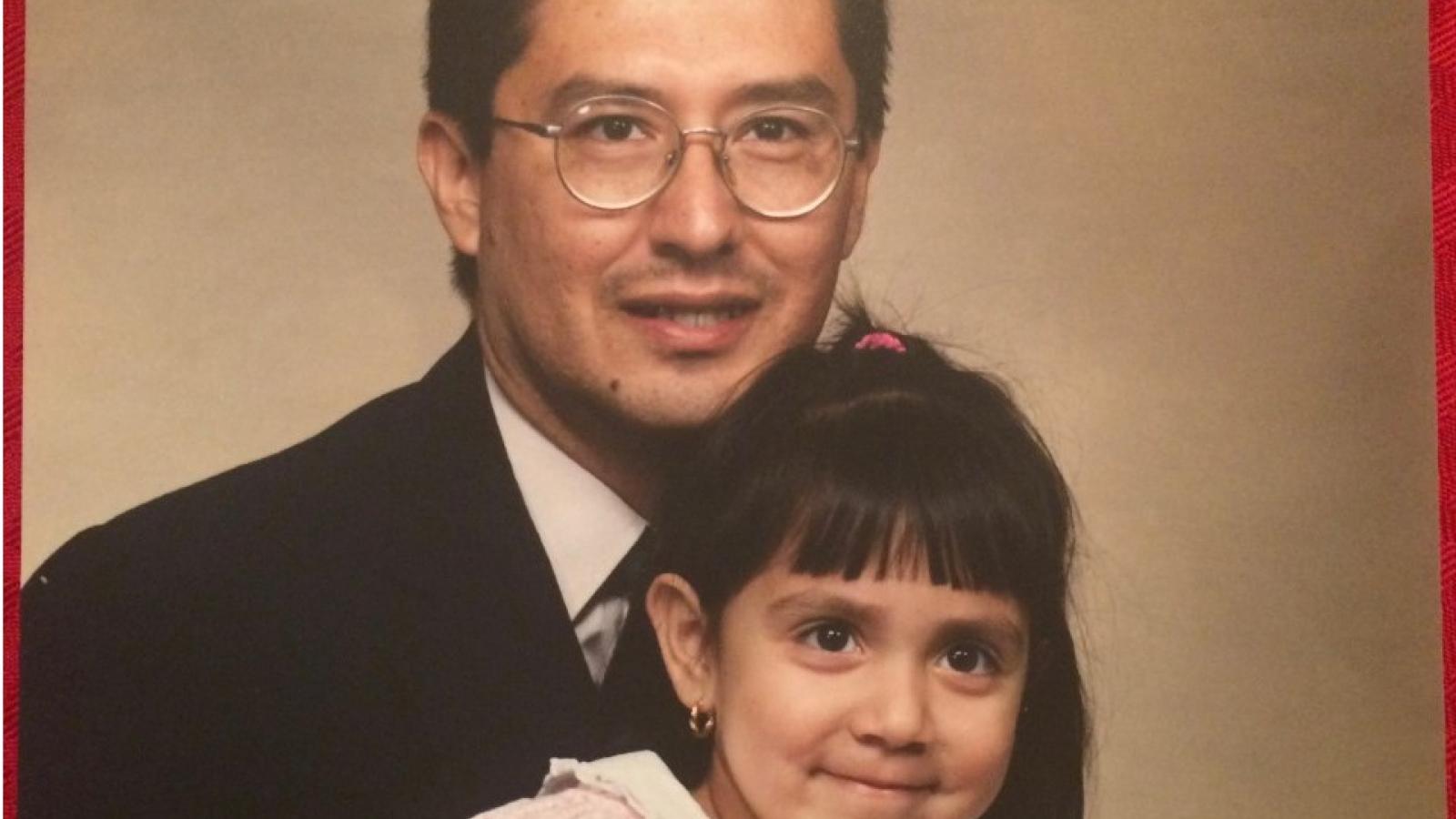 Young Laura with her father