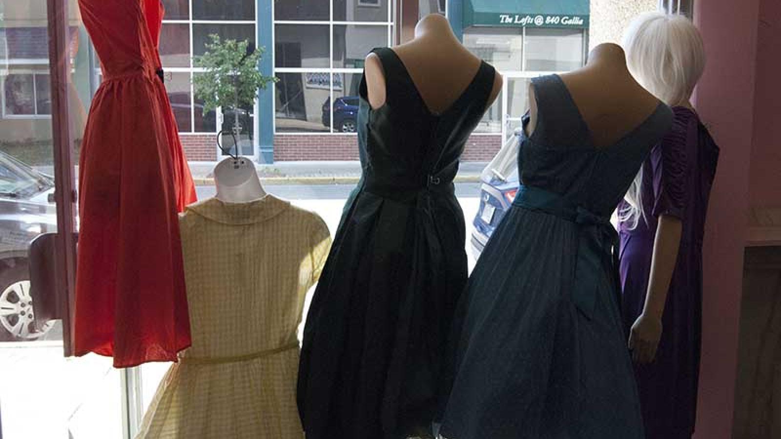window display dresses from behind