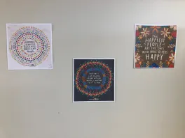 Motivational quote printouts hanging on the wall